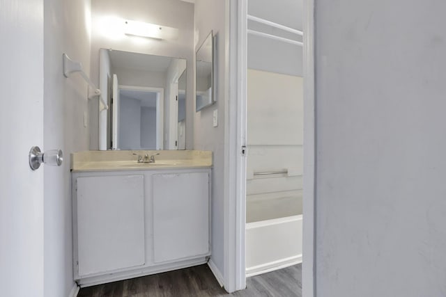 bathroom with hardwood / wood-style floors and vanity