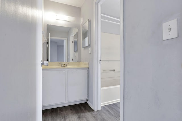 bathroom featuring vanity and hardwood / wood-style floors