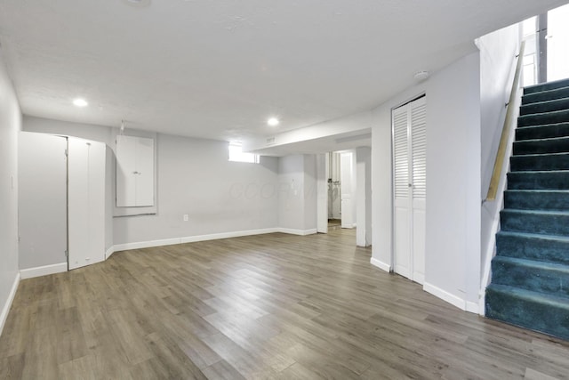 basement with hardwood / wood-style flooring