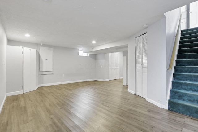 basement featuring light hardwood / wood-style floors