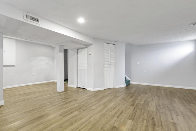 basement with light wood-type flooring