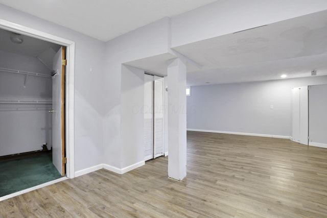 basement featuring light hardwood / wood-style floors