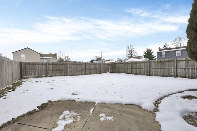 view of yard layered in snow