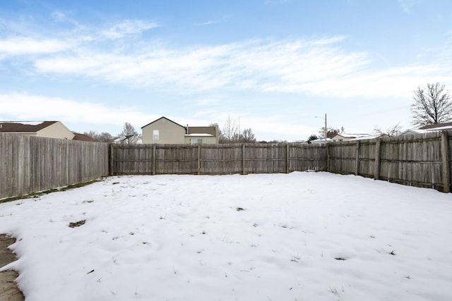 view of yard covered in snow