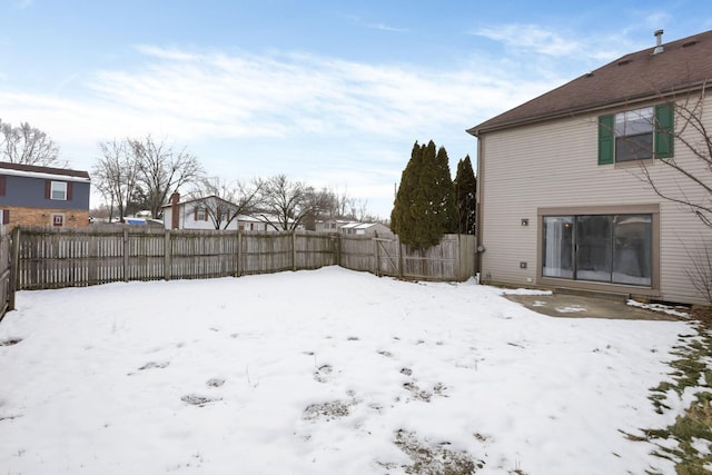 view of yard covered in snow