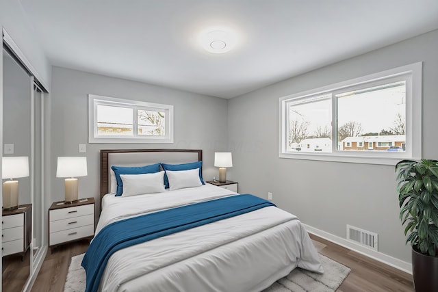 bedroom featuring a closet and hardwood / wood-style flooring