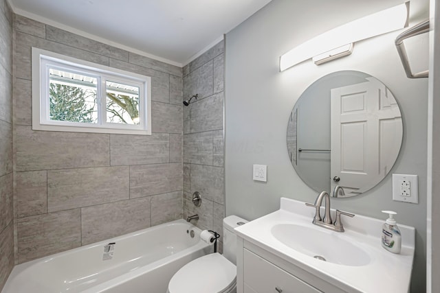 full bathroom featuring toilet, tiled shower / bath, and vanity