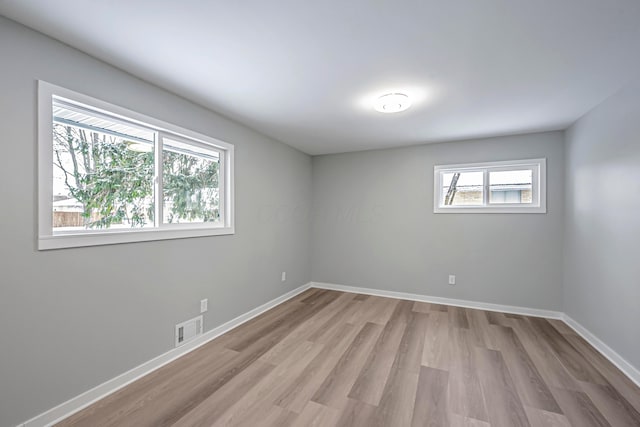 unfurnished room featuring light hardwood / wood-style flooring