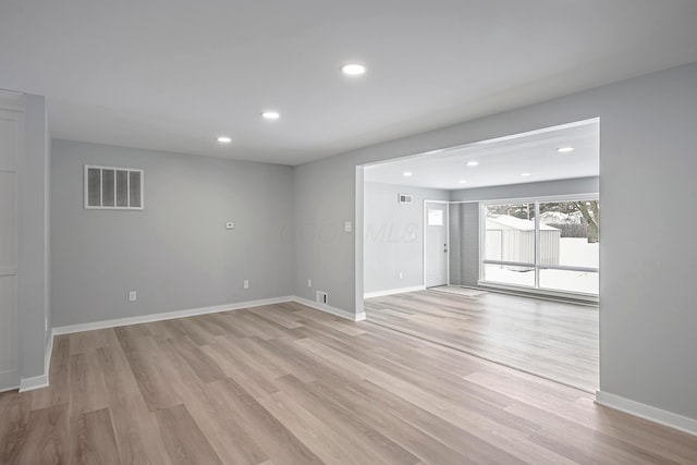 spare room featuring light wood-type flooring