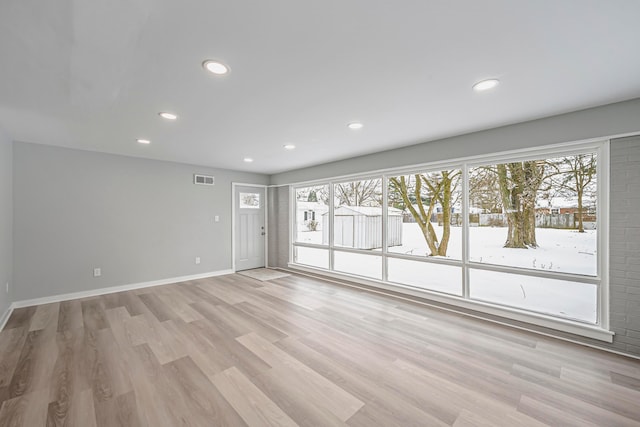 unfurnished room featuring light wood-type flooring