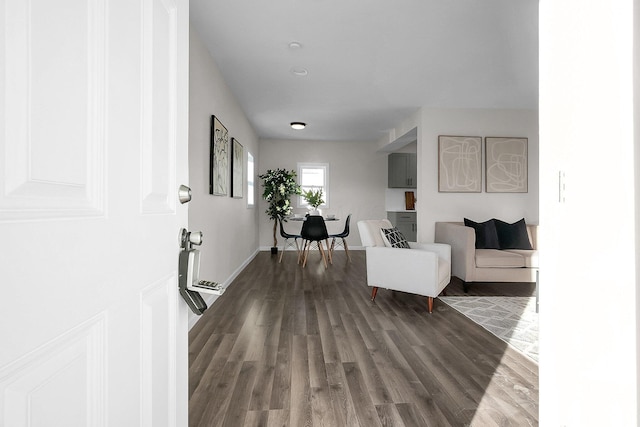 living room featuring dark wood-type flooring