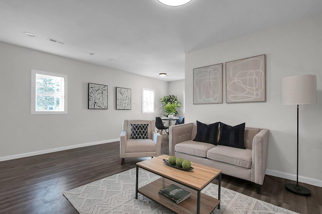 living room featuring dark hardwood / wood-style flooring