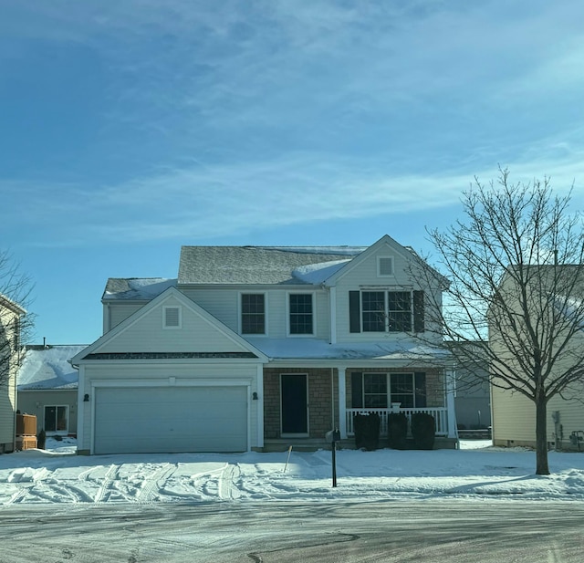 view of front of home with a garage and a porch