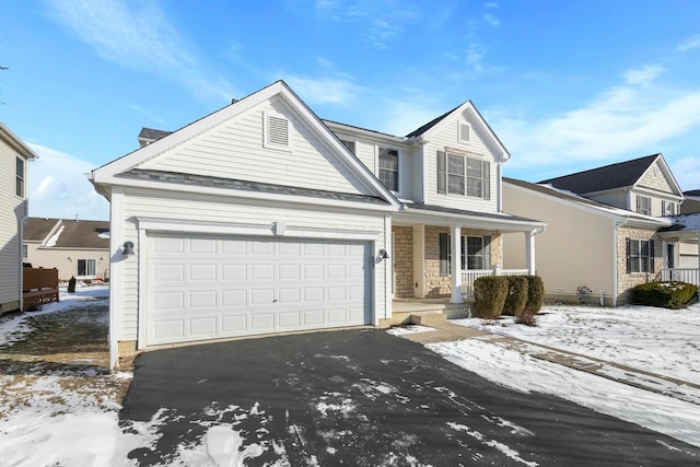 front of property featuring a porch and a garage