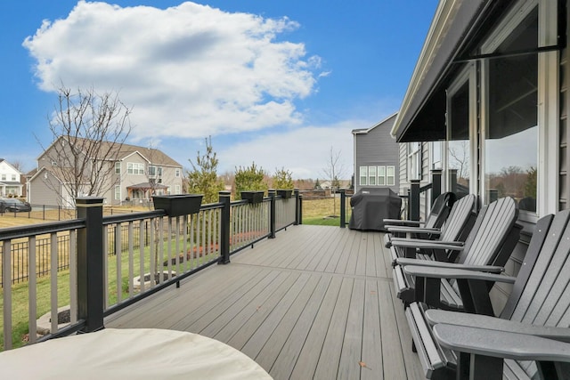 wooden terrace featuring grilling area