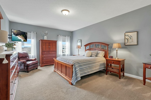 bedroom with light carpet