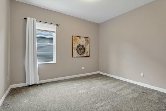 unfurnished room featuring carpet flooring