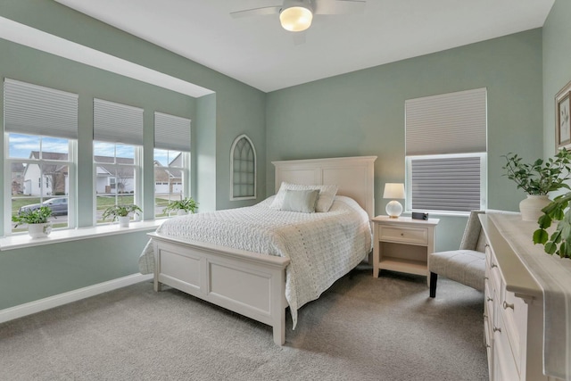 bedroom with light colored carpet and ceiling fan