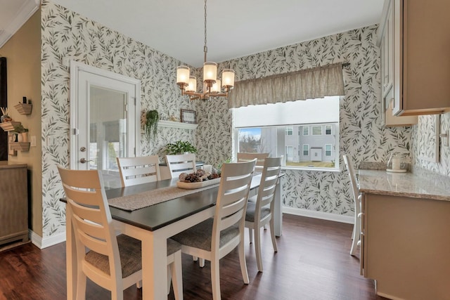 dining area with dark wood-type flooring and a chandelier