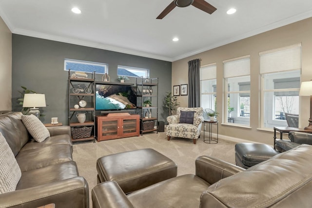 living room with a wealth of natural light, carpet floors, and ornamental molding