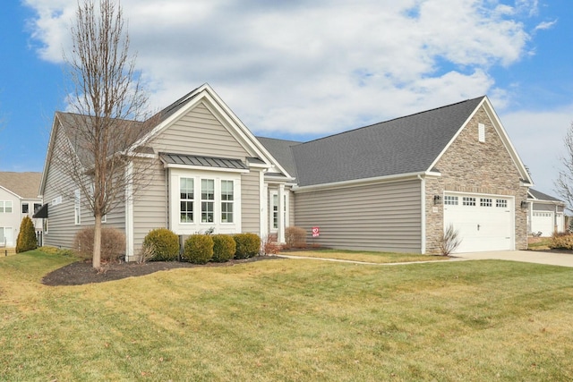 view of front of home with a garage and a front lawn