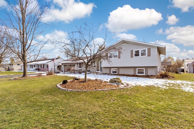 view of front of property featuring a garage and a front yard