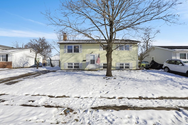 view of snow covered house