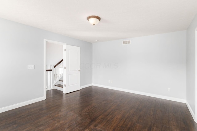 empty room featuring dark hardwood / wood-style floors