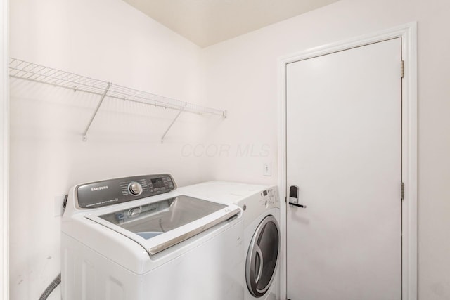 laundry room featuring separate washer and dryer