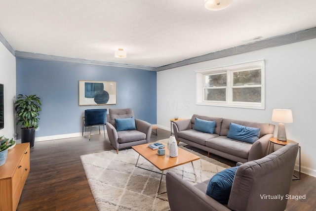 living room featuring dark wood-type flooring and ornamental molding