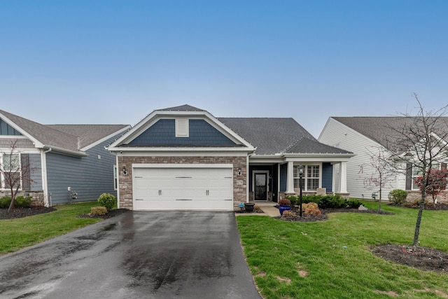 craftsman-style home with a garage and a front lawn