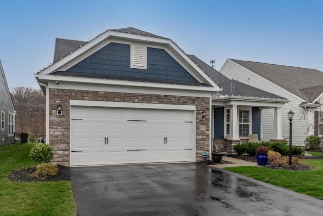 craftsman-style house featuring a garage and central air condition unit