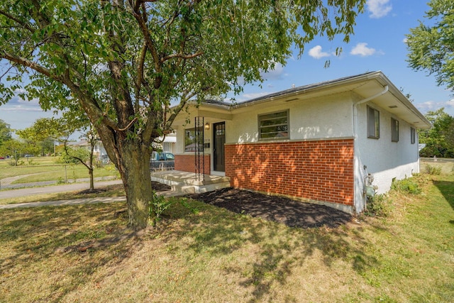 exterior space featuring a front lawn