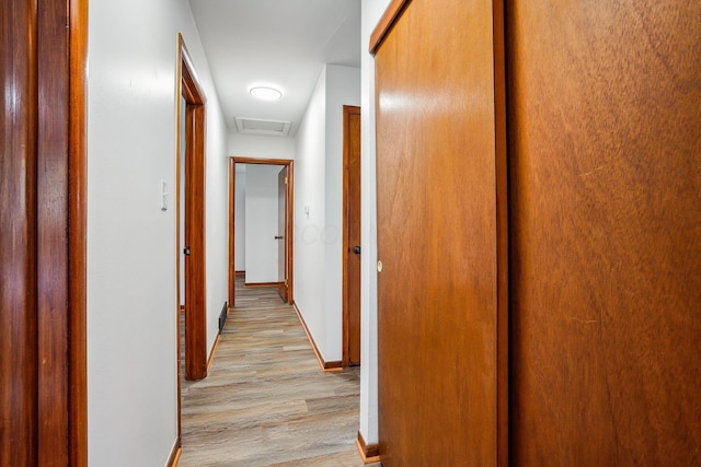 corridor featuring light hardwood / wood-style flooring