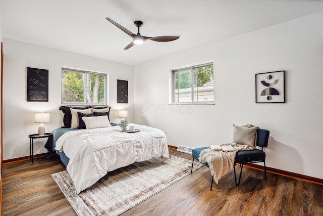 bedroom featuring ceiling fan and dark hardwood / wood-style flooring