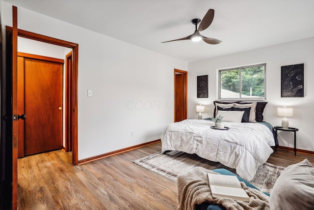 bedroom featuring ceiling fan and light hardwood / wood-style flooring