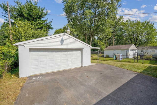 garage featuring a lawn