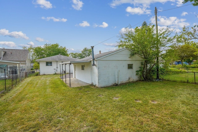 rear view of house featuring a lawn