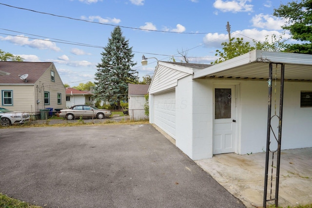 exterior space featuring an outdoor structure and a garage