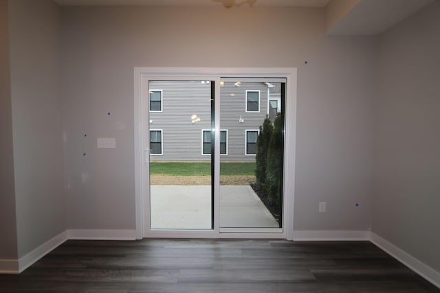 doorway with dark hardwood / wood-style flooring