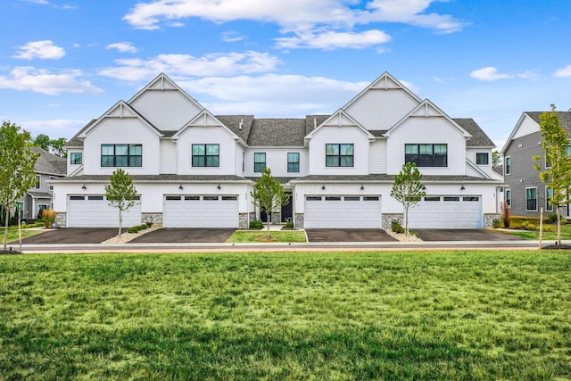 view of front of property featuring a garage and a front yard