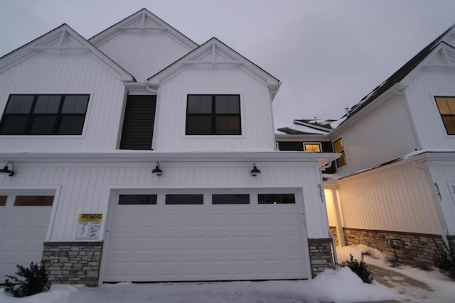 modern inspired farmhouse featuring a garage