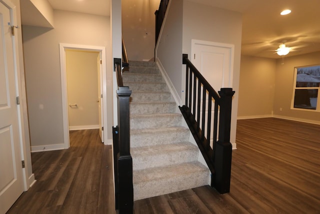 stairway featuring wood-type flooring