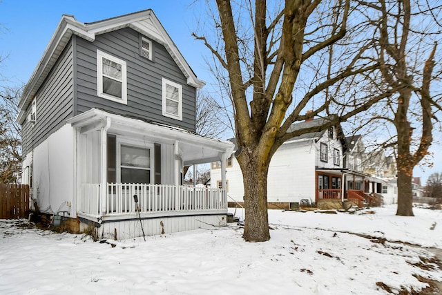 view of property featuring covered porch