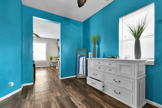 bedroom with dark wood-type flooring