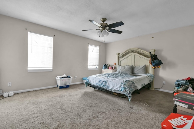 bedroom with ceiling fan and carpet flooring