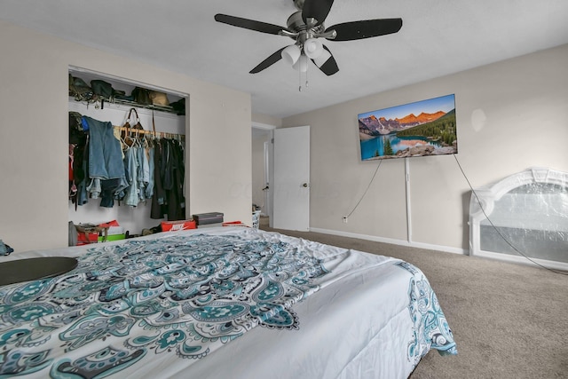 bedroom with ceiling fan, carpet flooring, and a closet