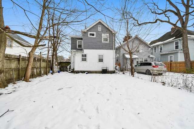 view of snow covered house