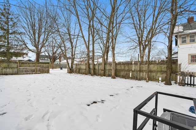 view of yard covered in snow