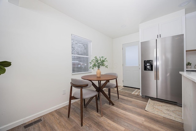 dining area featuring hardwood / wood-style floors